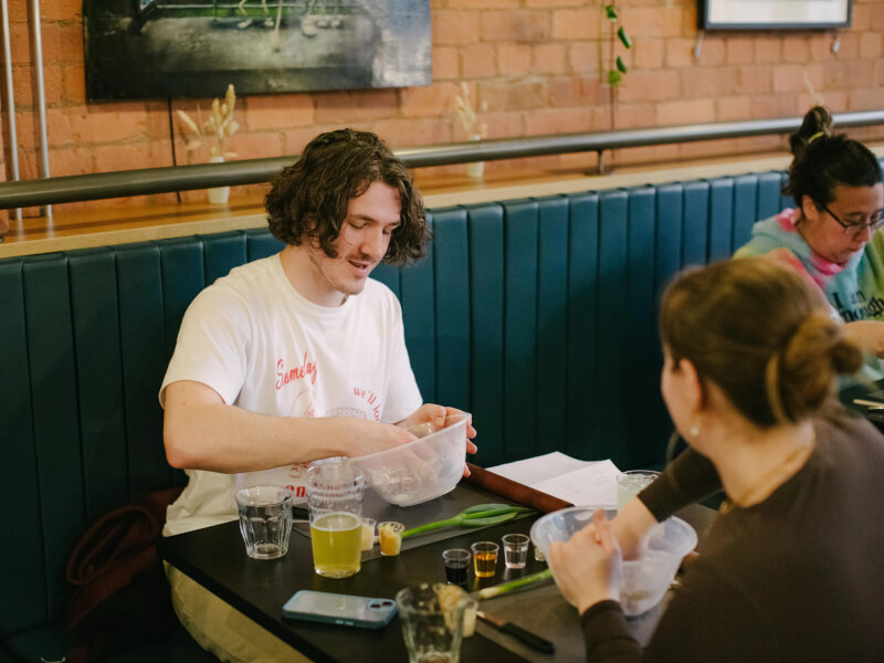 A man enjoying a cooking class with his new girlfriend