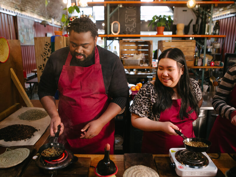 Romantic couple cooking together at a couples workshop