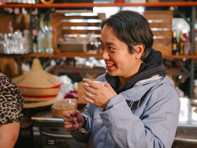 Man drinking cup of coffee at latte art class