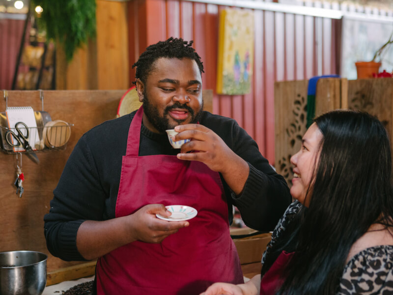 A man sips coffee at a barista workshop