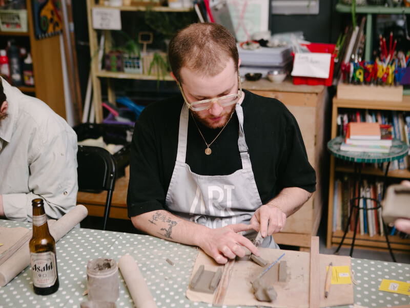 A man getting in the zone with pottery