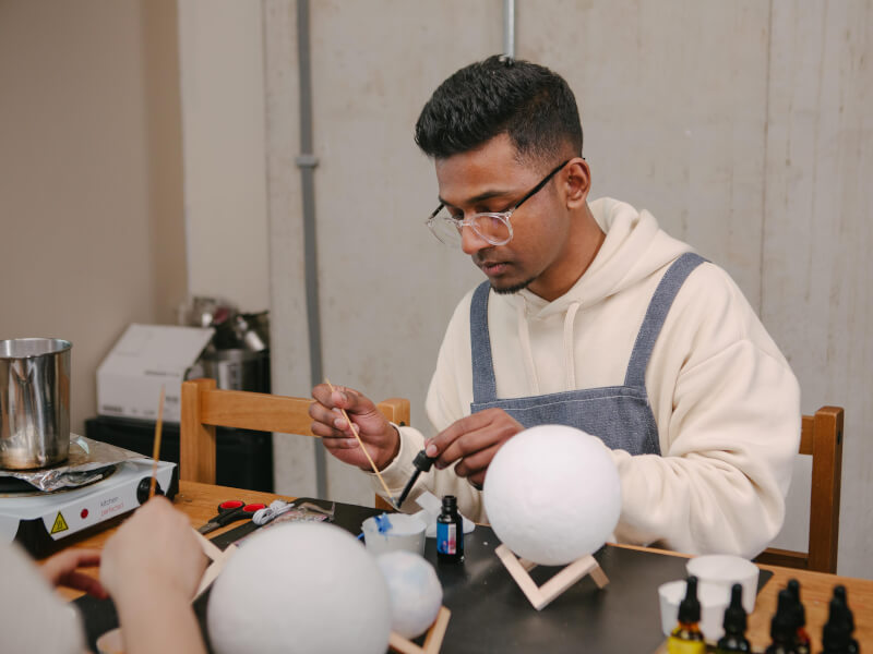 A man focusing on his activity at a workshop for him