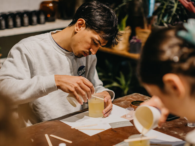 A man relaxes at a candle making workshop