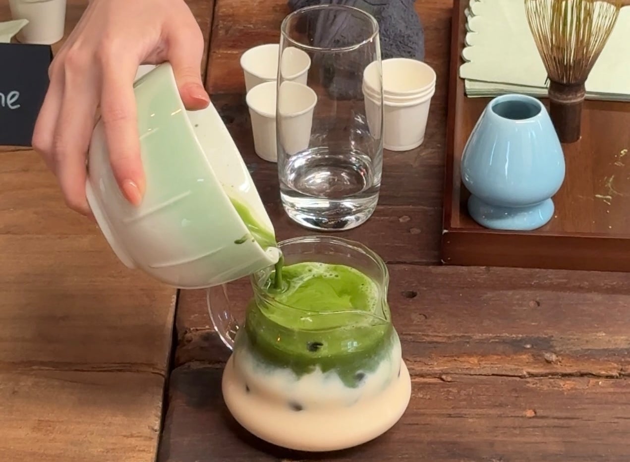 Person pouring matcha