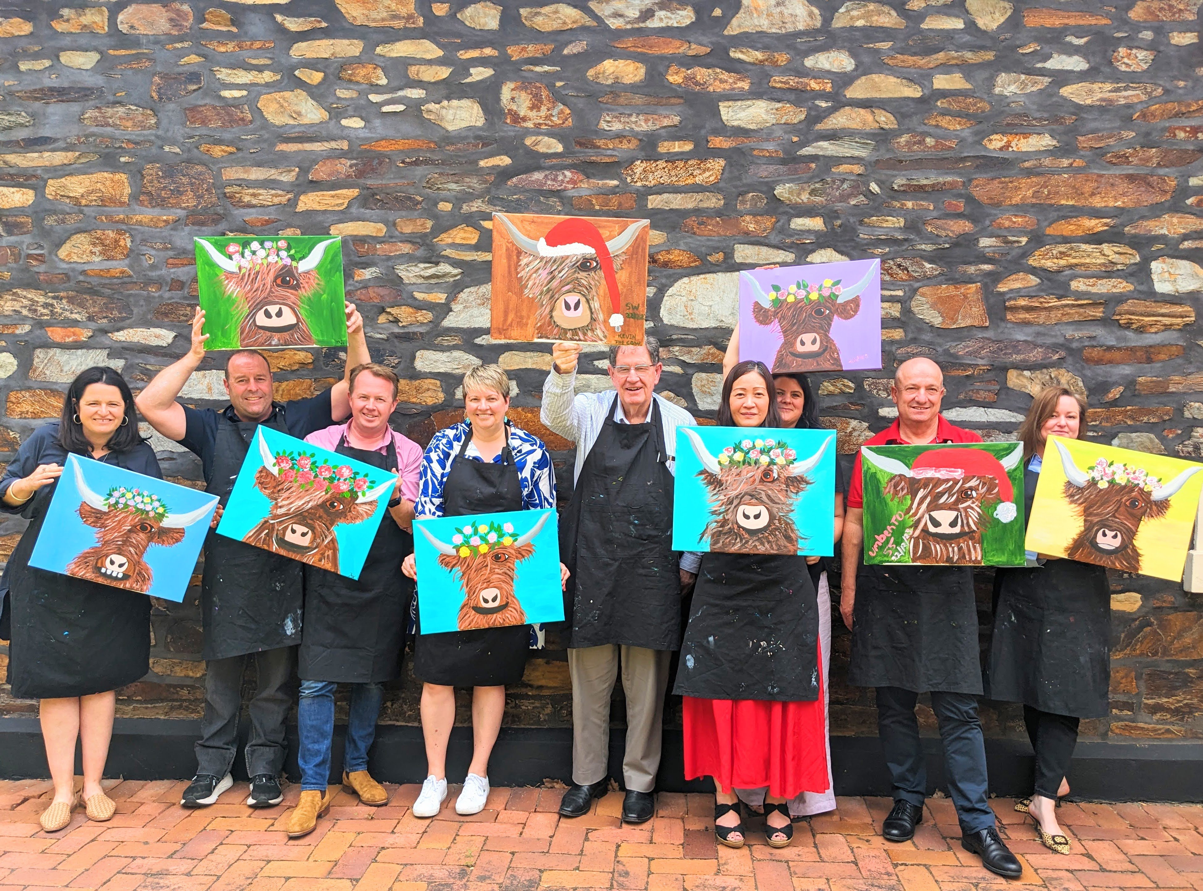 mobile paint and sip christmas party guests with paintings