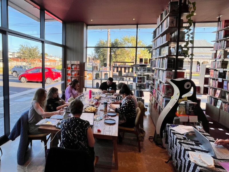Group of writers working on their writing at monthly bad writers club in Footscray