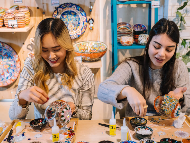 Women making a Turkish mosaic lamp