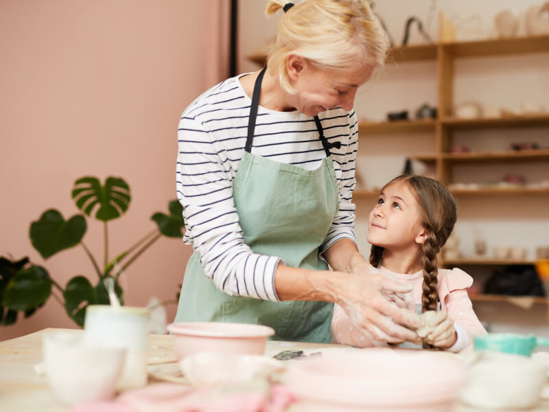 A mother and daughter at a festive clay workshop