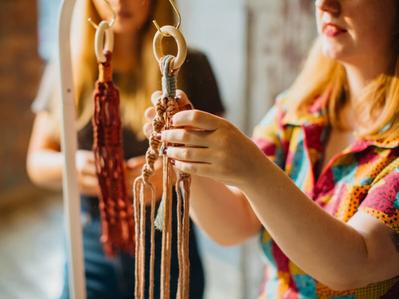 Mother and daughter attending a macrame workshop together