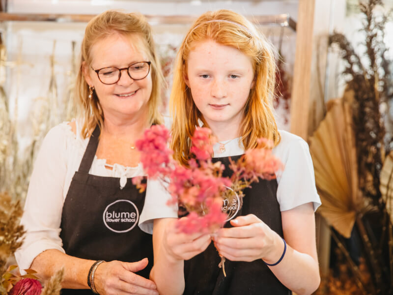 mum and daughter flower arranging