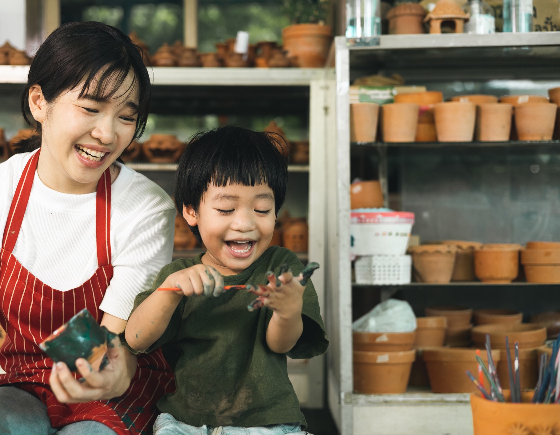 Mother and son bonding in a pottery class