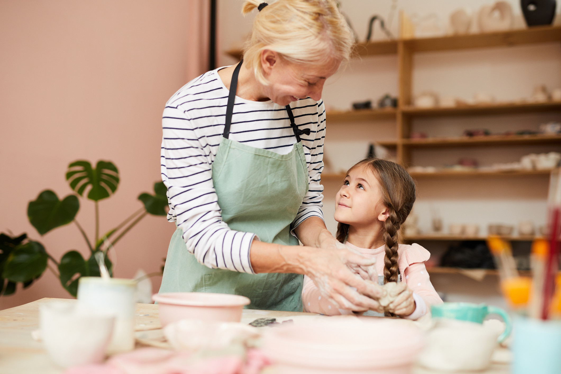 Mum and kid bonding in a pottery class