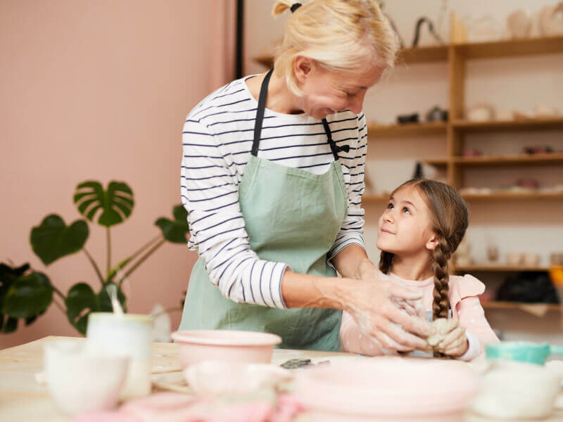 Mum and daughter bonding in a pottery class