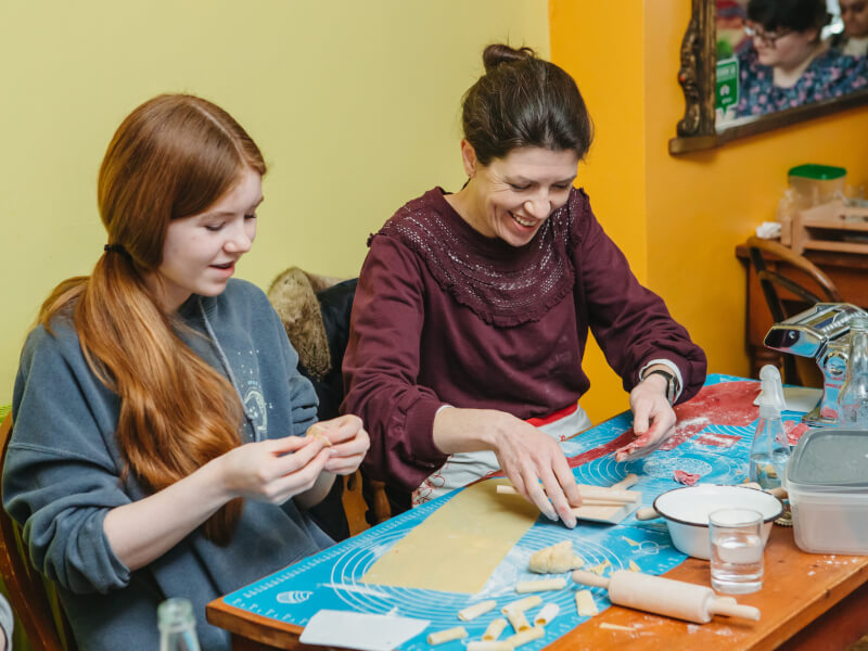 Mother and daughter making pasta at an Italian cooking class