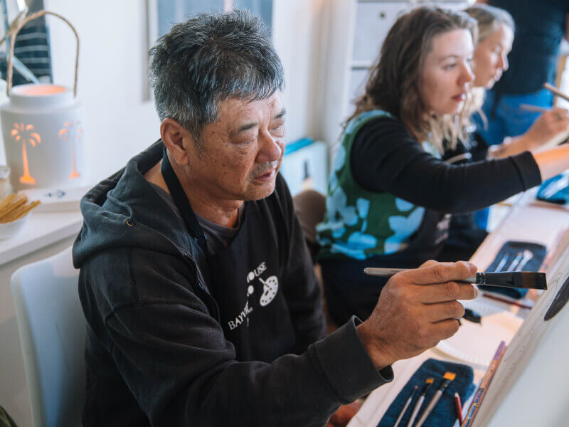 Man enjoying a painting class