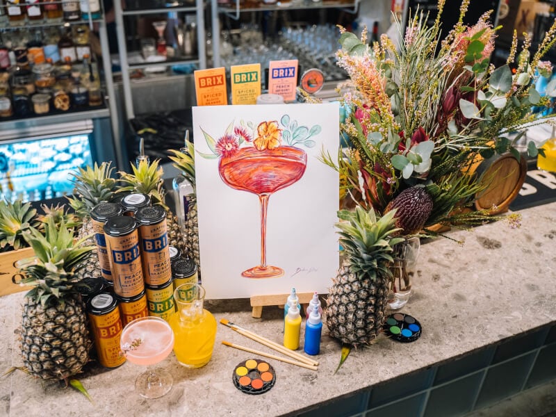 Painting of a cocktail surrounded by drinks