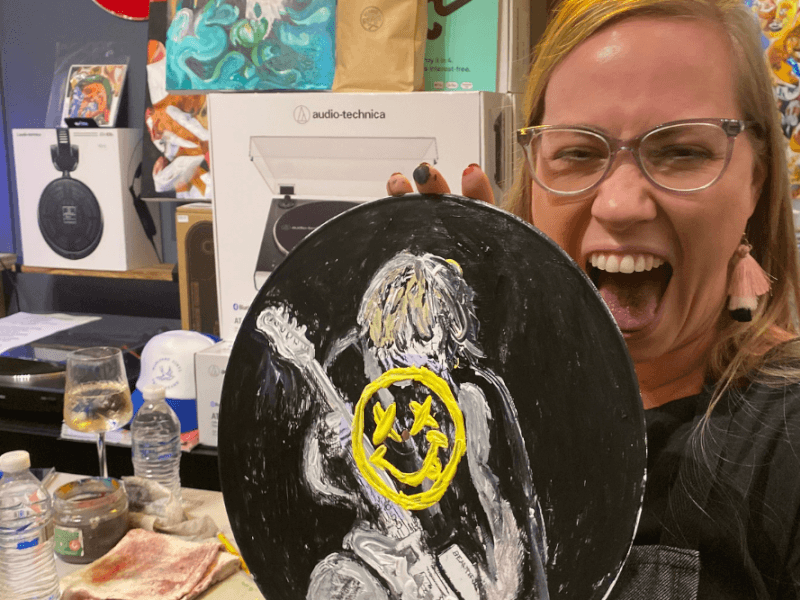woman having fun painting her own record