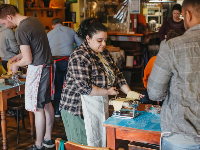 Group pasta making at a birthday party