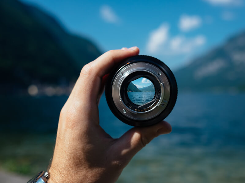 holding up camera lens