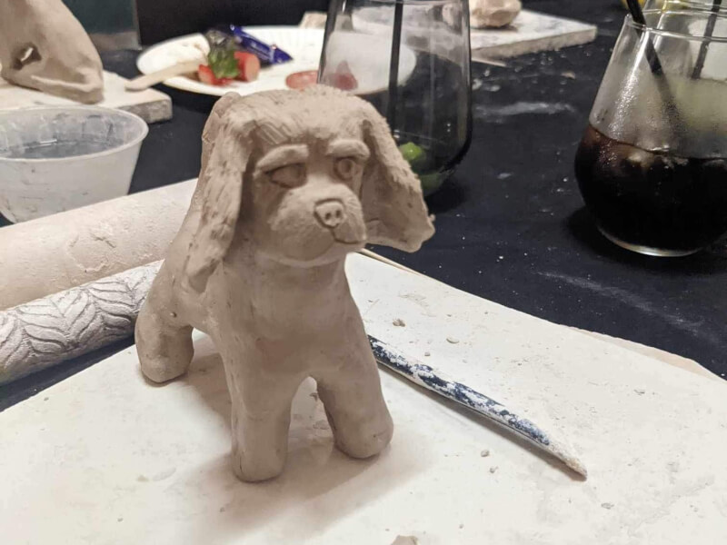 A small clay sculpture of a dog