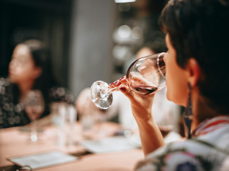 Woman tasting wine