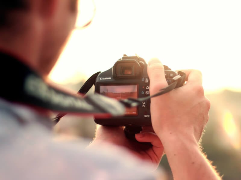 man with dslr camera