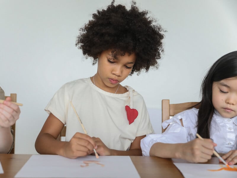 young girl painting at home
