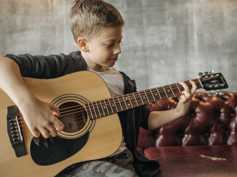 teenager playing guitar