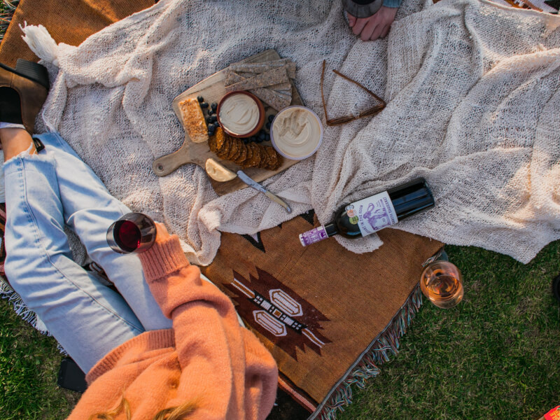 picnic set up with food and wine