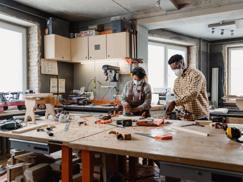 Woman and man wood working