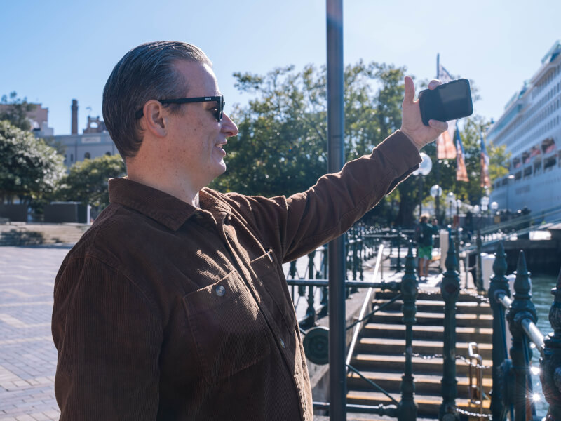 A man taking a photo with his smartphone