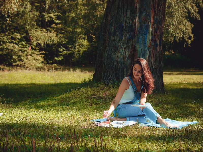 Woman painting in park
