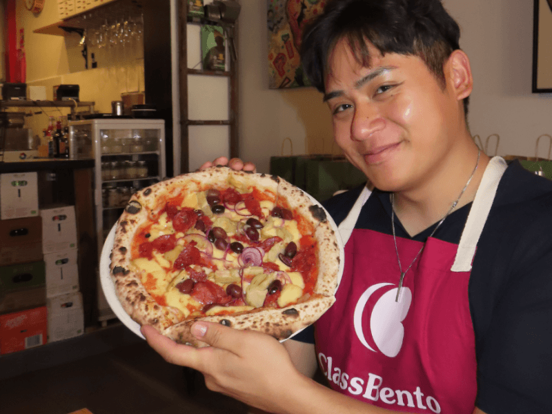 pizza masterclass with lunch - happy man with pizza