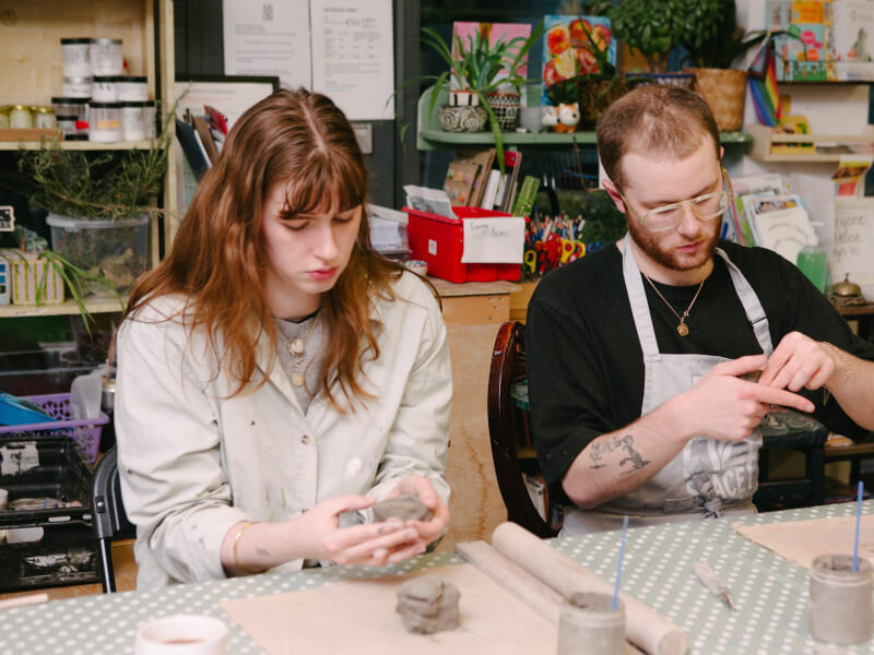 A couple at a pottery class