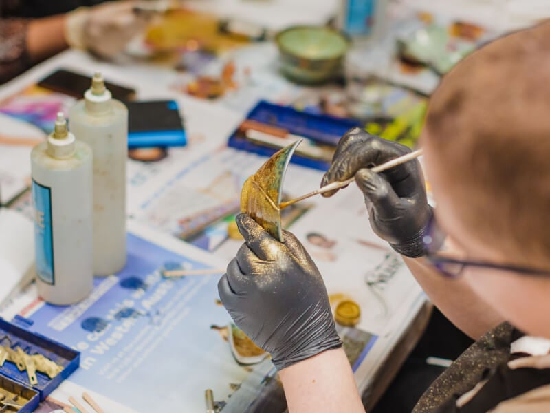 Child painting ceramics