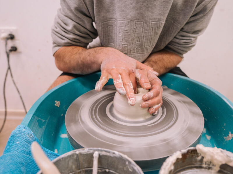 Person practicing wheel throwing