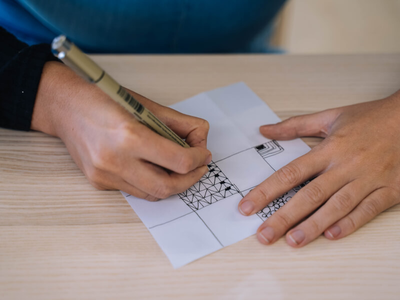 A person practicing drawing patterns
