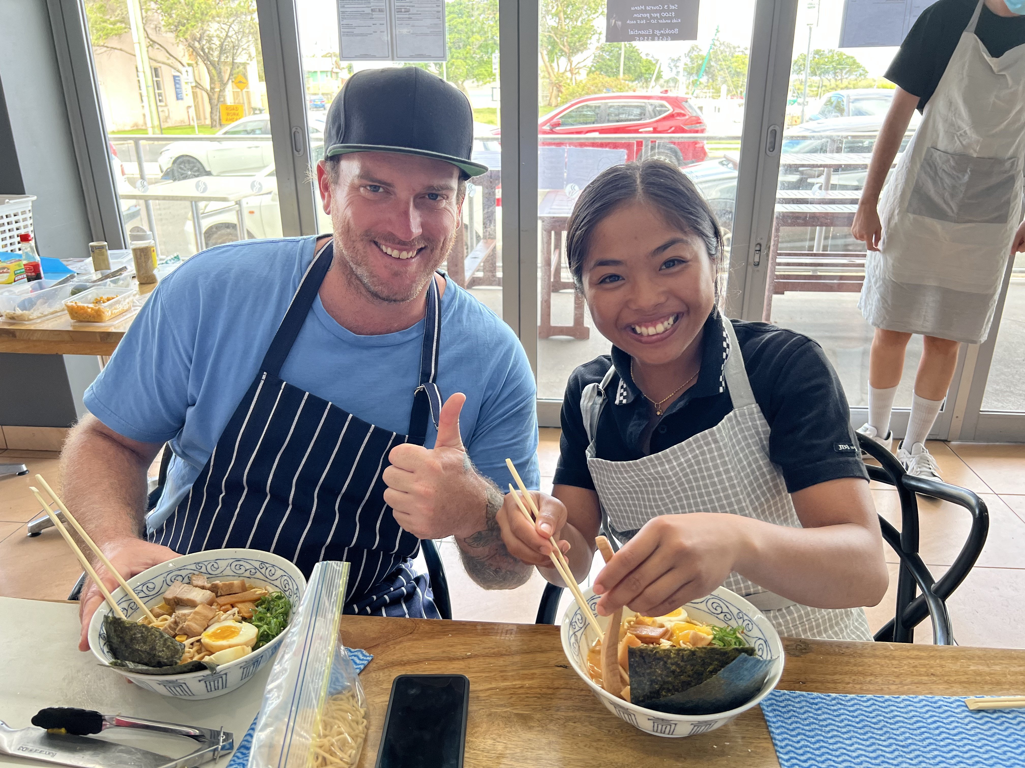 People showing off their handmade ramen 