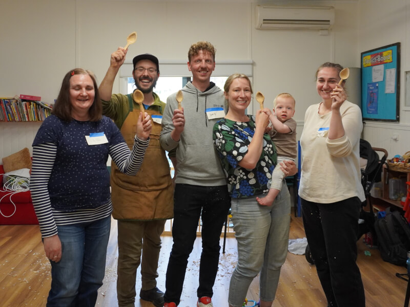 family at wooden spoon carving class