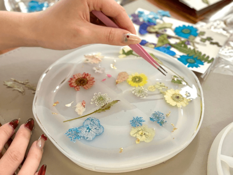 floral resin coasters being made
