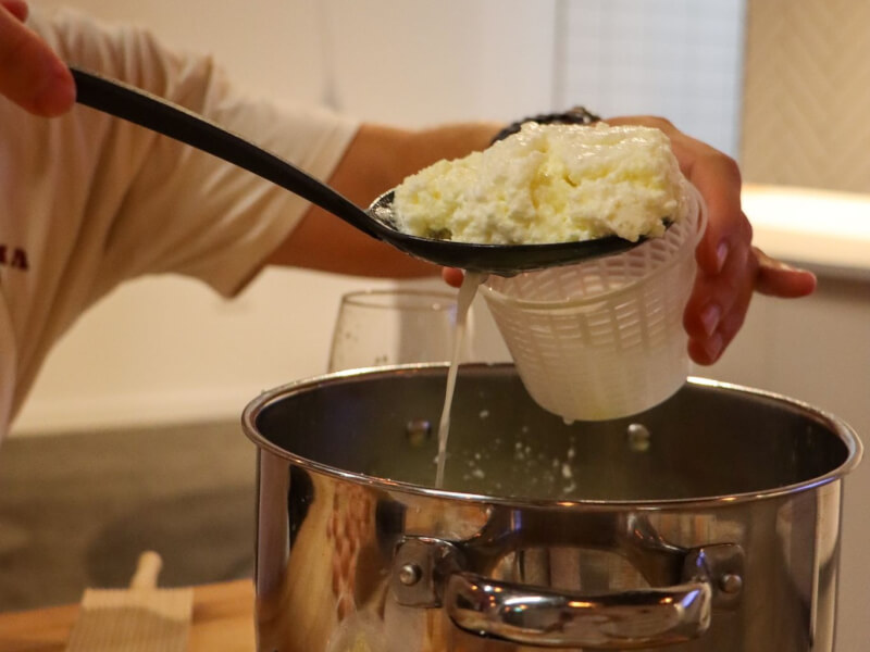 Ricotta being made