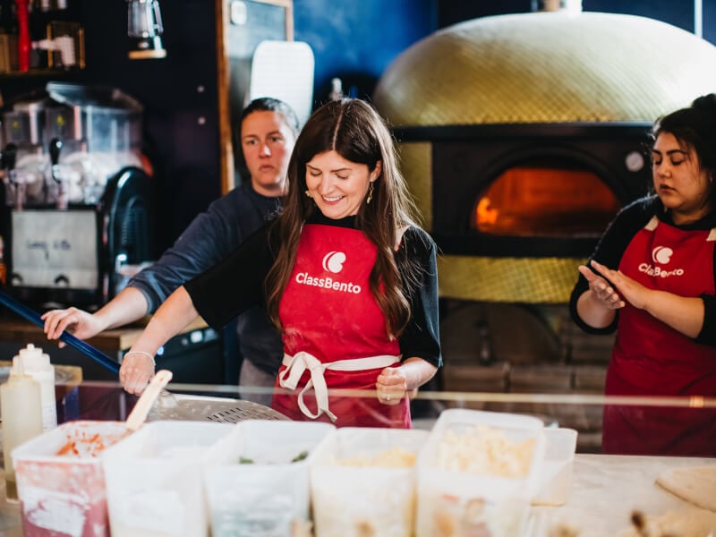 Woman smiling at a Mother's Day cooking class