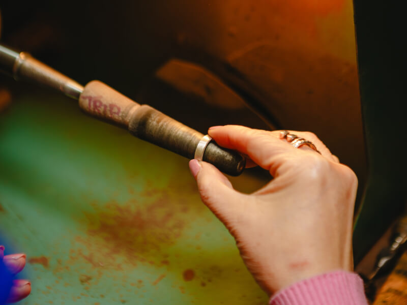 Hands in the process of ring making