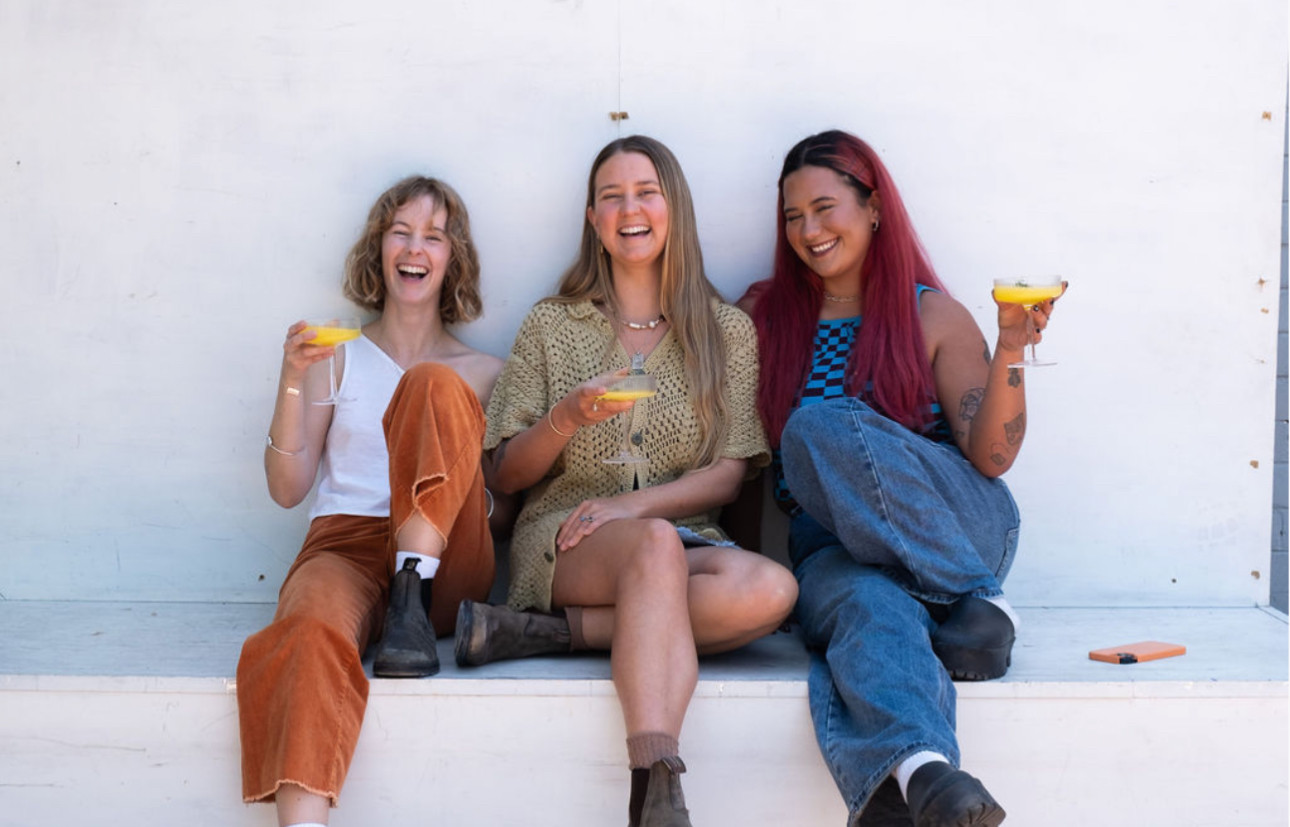 Women holding cocktails