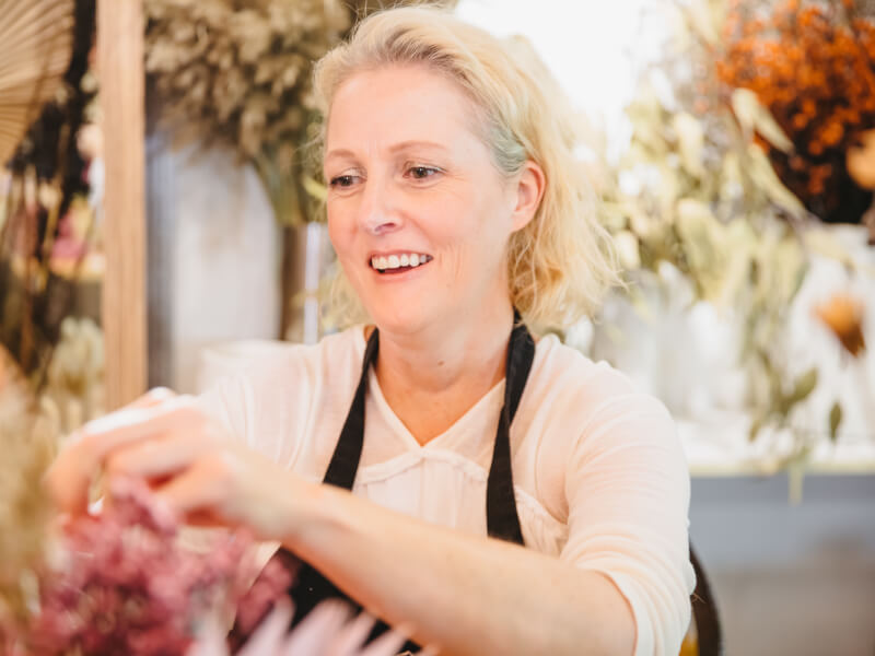 A mum enjoying a flower arranging class as her Mother's Day gift