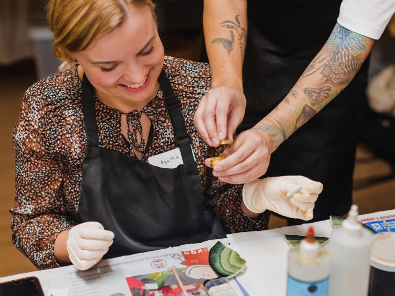 A woman smiling while making kintsugi