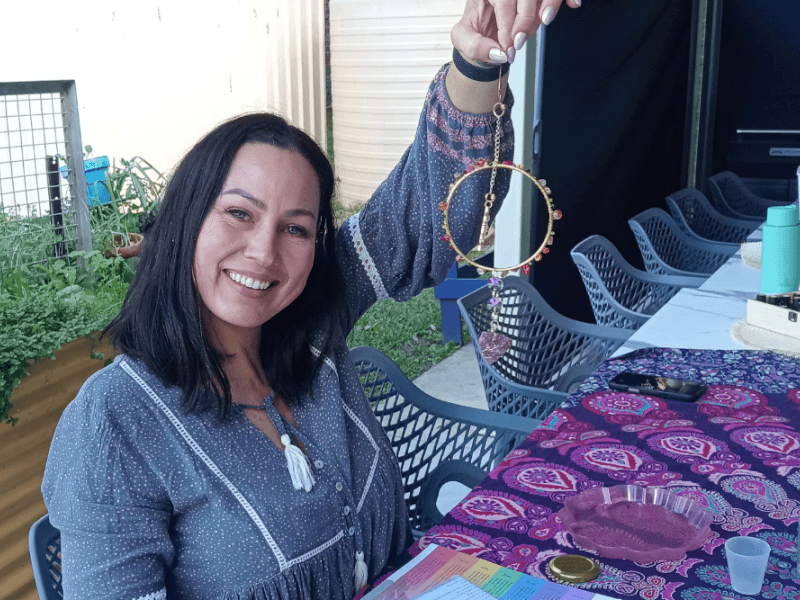Woman showing the sun catcher she made