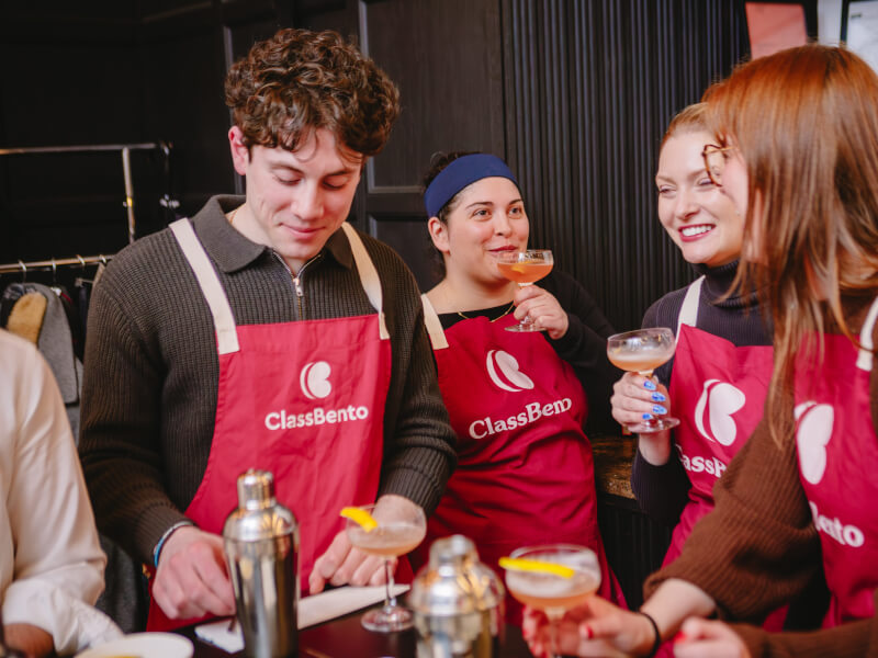 A group of colleagues making cocktails