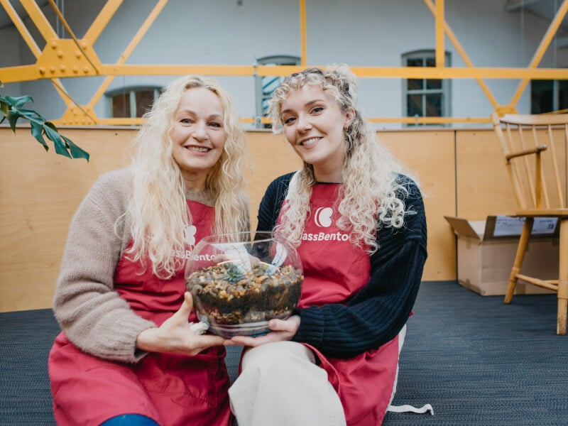 A mother and a daughter hold the terrarium they made together for Mother's Day