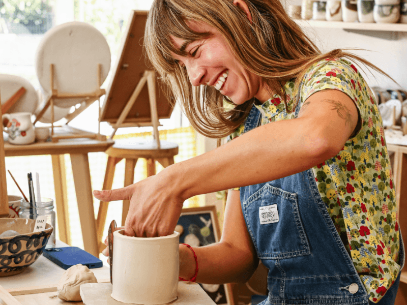 woman having fun in a pottery class